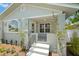 Inviting front porch features decorative tile flooring, painted brick and steps at 422 24Th N St, St Petersburg, FL 33713