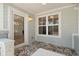 Front porch features decorative tile flooring, and an exterior entry door at 422 24Th N St, St Petersburg, FL 33713