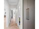 Hallway featuring stylish herringbone wood floors and convenient closet access at 422 24Th N St, St Petersburg, FL 33713
