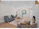 Bright living room featuring fireplace, stylish furnishings, and an arched window at 422 24Th N St, St Petersburg, FL 33713