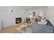 Open-concept living room features fireplace, modern decor, and hardwood floors at 422 24Th N St, St Petersburg, FL 33713