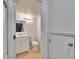 Bathroom featuring a white vanity, mirror, toilet, and neutral-colored walls at 4225 Barret Ave, Plant City, FL 33566