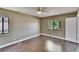 Bedroom with wood floors, neutral walls, white trim and water views at 4225 Barret Ave, Plant City, FL 33566