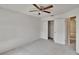 Neutral bedroom with a ceiling fan and an open closet space at 4225 Barret Ave, Plant City, FL 33566