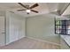 Bedroom with large windows, closet, and ceiling fan at 4225 Barret Ave, Plant City, FL 33566