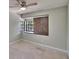 Bedroom with bay window, neutral wall paint and plush carpeting at 4225 Barret Ave, Plant City, FL 33566