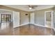 Bedroom with wood floors, white trim, and access to the attached bathroom at 4225 Barret Ave, Plant City, FL 33566