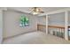 Neutral bedroom with a large window and a view of the backyard at 4225 Barret Ave, Plant City, FL 33566