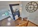 A beautiful entryway with a large decorative clock and hardwood floors at 4225 Barret Ave, Plant City, FL 33566