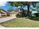 Inviting two-story home with an attached two car garage, driveway and well maintained lawn at 4225 Barret Ave, Plant City, FL 33566