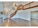 Spacious living room boasts hardwood floors, staircase, and an open floor plan at 4225 Barret Ave, Plant City, FL 33566