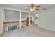 Spacious living room featuring high ceilings, open railing and abundant natural light at 4225 Barret Ave, Plant City, FL 33566