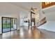 Open concept living room with hardwood floors, vaulted ceilings, and access to the screened patio at 4225 Barret Ave, Plant City, FL 33566