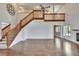 Expansive living room features wood floors, a staircase, fireplace, and abundant natural light at 4225 Barret Ave, Plant City, FL 33566