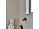 Close-up of the toilet in a half-bath with neutral decor at 4225 Barret Ave, Plant City, FL 33566
