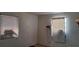 Modest bedroom featuring two windows and neutral walls with minimal decor at 4331 16Th S Ave, St Petersburg, FL 33711