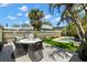 Backyard featuring an outdoor dining area and a sparkling pool, perfect for relaxation at 4829 20Th N Ave, St Petersburg, FL 33713