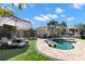 Serene backyard with a pool, lounge chairs, and lush greenery, ideal for outdoor enjoyment at 4829 20Th N Ave, St Petersburg, FL 33713