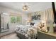 Comfortable bedroom with neutral tones, soft lighting, and a large window overlooking the outdoors at 4829 20Th N Ave, St Petersburg, FL 33713