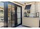 Stylish glass doors open to reveal a glimpse of the light-filled interior design at 4829 20Th N Ave, St Petersburg, FL 33713