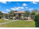 Inviting single-story home with a walkway, manicured lawn, pretty landscaping, and lovely curb appeal at 4829 20Th N Ave, St Petersburg, FL 33713