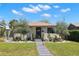 Charming single-story home with a well-manicured lawn, beautiful landscaping, and a welcoming entryway at 4829 20Th N Ave, St Petersburg, FL 33713