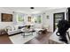 Bright living room with white walls, lots of natural light, hardwood floors, and stylish decor at 4829 20Th N Ave, St Petersburg, FL 33713