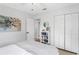 Bright bedroom featuring a closet, a bed with modern decor, and plenty of storage at 5254 23Rd N Ave, St Petersburg, FL 33710