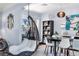 Dining room featuring a hanging chair, view to office space, and stylish decor, creating a cozy and inviting atmosphere at 5254 23Rd N Ave, St Petersburg, FL 33710