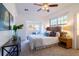 Cozy bedroom featuring a unique headboard, a ceiling fan, and natural lighting at 56 W Park St, Tarpon Springs, FL 34689