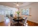 Cozy dining room featuring hardwood floors and a round table with chairs, ideal for intimate meals and gatherings at 56 W Park St, Tarpon Springs, FL 34689