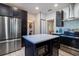 This kitchen features stainless steel appliances and a built in microwave in the kitchen island at 56 W Park St, Tarpon Springs, FL 34689