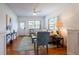 Inviting living room showcasing hardwood floors, a couch, and natural light, offering comfortable space at 56 W Park St, Tarpon Springs, FL 34689