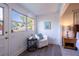 Bright sitting area featuring a large window, comfortable chair, and modern accents at 56 W Park St, Tarpon Springs, FL 34689