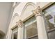 Close-up on ornate architectural detailing, decorative pilasters, and large windows on a beautiful home at 601 Bosphorous Ave, Tampa, FL 33606