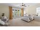 Spacious bedroom with French doors to a private balcony, plush carpet, and dual nightstands at 601 Bosphorous Ave, Tampa, FL 33606