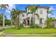 Well-manicured front yard of a Mediterranean-style home with lush landscaping at 601 Bosphorous Ave, Tampa, FL 33606