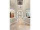 Inviting hallway with arched doorways and tiled flooring provides seamless flow throughout the home at 601 Bosphorous Ave, Tampa, FL 33606