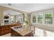 Bright, open kitchen boasts an island with granite countertop and stainless appliances overlooking the living area at 601 Bosphorous Ave, Tampa, FL 33606