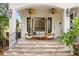 Covered patio features tiled flooring, overhead fans, comfortable seating, and easy access to the outdoors at 601 Bosphorous Ave, Tampa, FL 33606