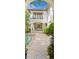 Gorgeous courtyard with a pool, featuring a balcony and elegant outdoor living space, enhanced by lush greenery at 601 Bosphorous Ave, Tampa, FL 33606