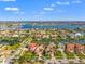 Aerial view of community with waterfront homes and sailboat marina nearby at 6315 Marbella Blvd, Apollo Beach, FL 33572