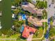 Aerial view of multiple waterfront homes in a tropical community with private boat docks at 6315 Marbella Blvd, Apollo Beach, FL 33572