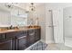 Spacious bathroom with double sink vanity, granite counters, and a large mirror at 6315 Marbella Blvd, Apollo Beach, FL 33572