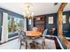 Dining room featuring dark blue walls, a round table, chairs, and hutch at 6315 Marbella Blvd, Apollo Beach, FL 33572
