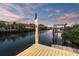 Private dock with boat lift system at sunset at 6315 Marbella Blvd, Apollo Beach, FL 33572