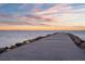 Picturesque waterfront view of a long dock leading into the tranquil bay waters at 6315 Marbella Blvd, Apollo Beach, FL 33572