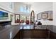 Open-concept design kitchen featuring an island with a sink and views into the living room at 6315 Marbella Blvd, Apollo Beach, FL 33572