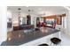 Bright kitchen featuring a spacious island, stainless steel appliances, and an adjacent dining area at 6315 Marbella Blvd, Apollo Beach, FL 33572
