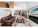 A well-lit living room featuring an open floor plan, comfortable seating, and decor at 6315 Marbella Blvd, Apollo Beach, FL 33572